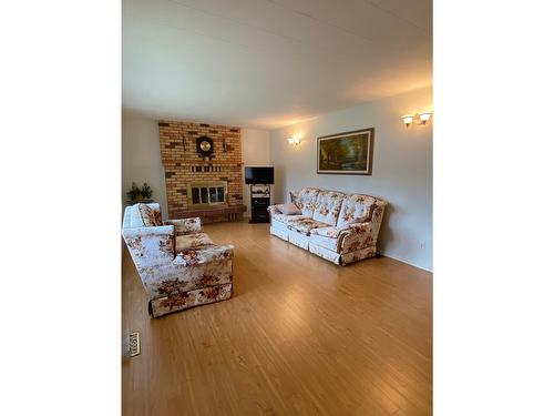 2705 5Th Avenue, Castlegar, BC - Indoor Photo Showing Living Room With Fireplace