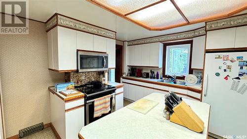 106 2Nd Street E, Dinsmore, SK - Indoor Photo Showing Kitchen With Double Sink