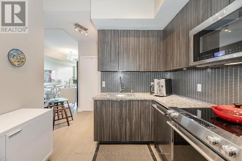 312 - 20 Shore Breeze Drive, Toronto (Mimico), ON - Indoor Photo Showing Kitchen With Upgraded Kitchen