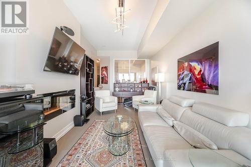 312 - 20 Shore Breeze Drive, Toronto (Mimico), ON - Indoor Photo Showing Living Room With Fireplace