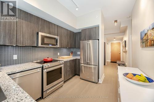 312 - 20 Shore Breeze Drive, Toronto (Mimico), ON - Indoor Photo Showing Kitchen With Upgraded Kitchen