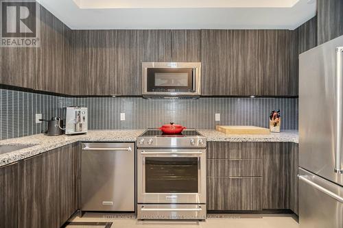 312 - 20 Shore Breeze Drive, Toronto (Mimico), ON - Indoor Photo Showing Kitchen With Upgraded Kitchen