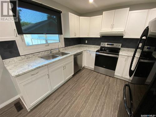 211 Eighth Avenue N, Yorkton, SK - Indoor Photo Showing Kitchen With Double Sink