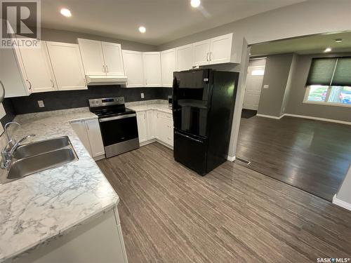 211 Eighth Avenue N, Yorkton, SK - Indoor Photo Showing Kitchen With Double Sink