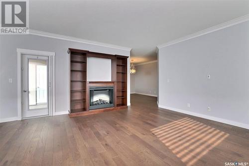 305 3750 Haughton Road E, Regina, SK - Indoor Photo Showing Living Room With Fireplace