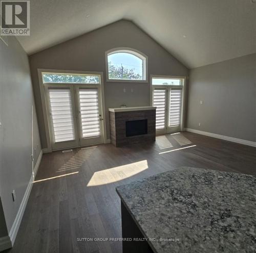 11 - 273 Riddell Street, Woodstock, ON - Indoor Photo Showing Other Room With Fireplace