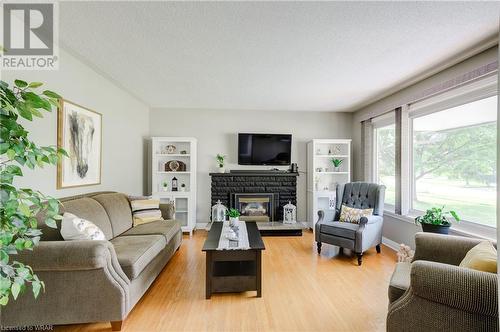 215 Brenda Crescent, Woodstock, ON - Indoor Photo Showing Living Room With Fireplace