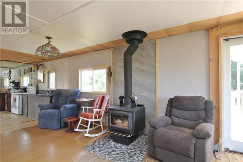 1028 Mitchell Road, Lanark Highlands, ON - Indoor Photo Showing Living Room With Fireplace