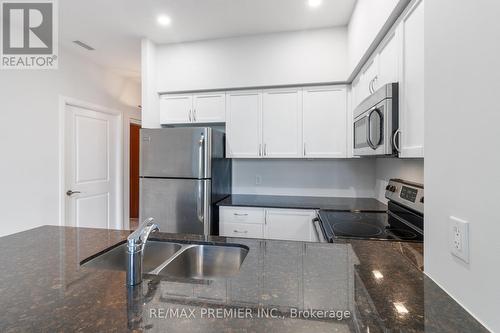 101 - 4700 Highway 7, Vaughan, ON - Indoor Photo Showing Kitchen With Double Sink