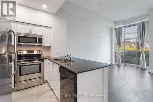 101 - 4700 Highway 7, Vaughan, ON - Indoor Photo Showing Kitchen With Double Sink