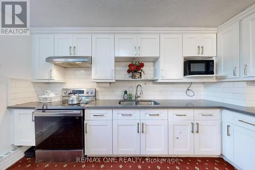 410 - 100 Wingarden Court, Toronto (Malvern), ON - Indoor Photo Showing Kitchen With Double Sink