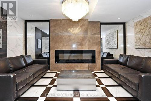 410 - 100 Wingarden Court, Toronto (Malvern), ON - Indoor Photo Showing Living Room With Fireplace