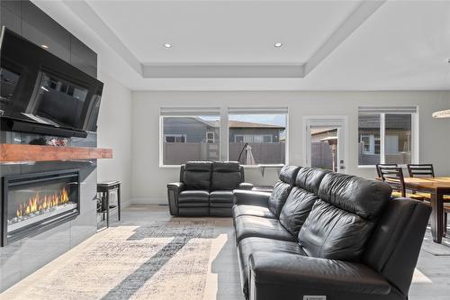 2237 Rahn Street, Armstrong, BC - Indoor Photo Showing Living Room With Fireplace