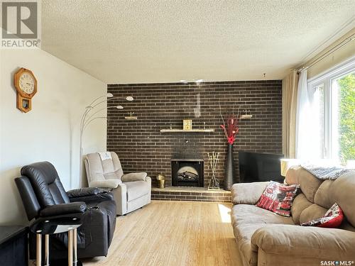 2114 37Th Street W, Saskatoon, SK - Indoor Photo Showing Living Room With Fireplace