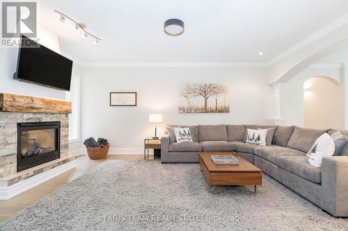 2 Reillys Run, Springwater (Minesing), ON - Indoor Photo Showing Living Room With Fireplace