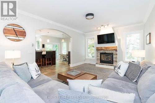 2 Reillys Run, Springwater (Minesing), ON - Indoor Photo Showing Living Room With Fireplace