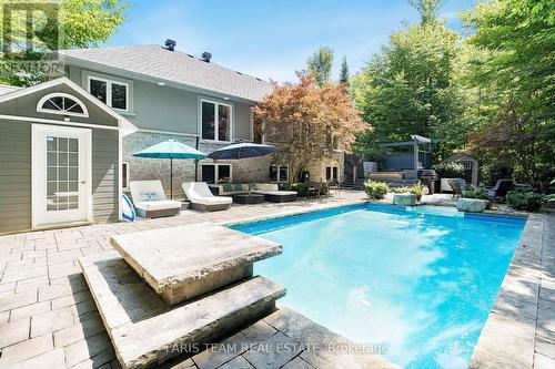 2 Reillys Run, Springwater (Minesing), ON - Outdoor With In Ground Pool With Deck Patio Veranda