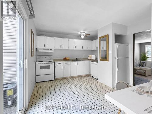 This room is virtually staged. - 11 - 135 Andover Drive, London, ON - Indoor Photo Showing Kitchen