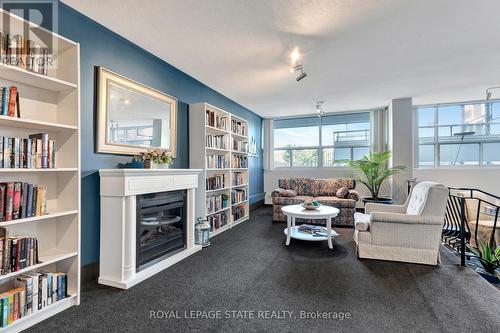 1505 - 2263 Marine Drive, Oakville (Bronte West), ON - Indoor Photo Showing Living Room With Fireplace