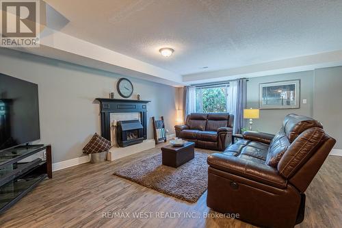 125 Riverview Road, New Tecumseth, ON - Indoor Photo Showing Living Room With Fireplace