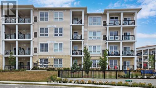 118 - 50 Lakebreeze Drive, Clarington (Newcastle), ON - Outdoor With Balcony With Facade