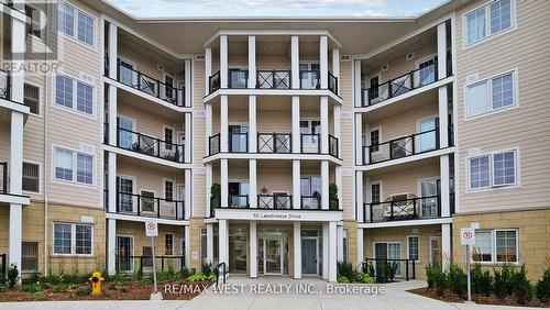 118 - 50 Lakebreeze Drive, Clarington (Newcastle), ON - Outdoor With Balcony With Facade