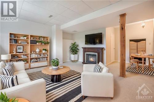 VIRTUALLY STAGED - 1497 Bourcier Drive, Ottawa, ON - Indoor With Fireplace