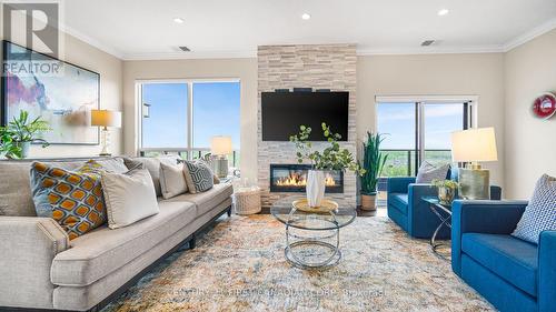 1403 - 240 Villagewalk Boulevard, London, ON - Indoor Photo Showing Living Room With Fireplace