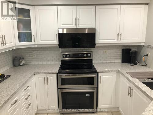 3 - 1050 Grand Boulevard, Oakville (Iroquois Ridge South), ON - Indoor Photo Showing Kitchen With Stainless Steel Kitchen With Double Sink