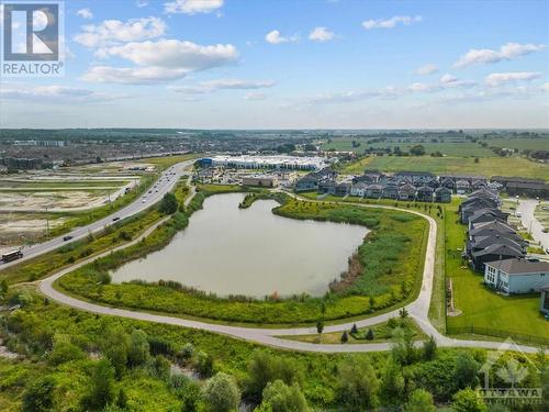 Small walking/biking trail goes around pond area. - 106 Westphalian Avenue, Ottawa, ON - Outdoor With View