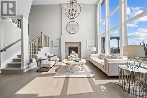 Lots of unobstructed  natural light - 106 Westphalian Avenue, Ottawa, ON - Indoor Photo Showing Living Room With Fireplace