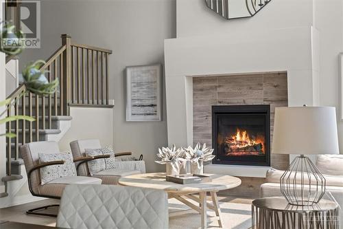 Modern 2 storey Gas fireplace detail  in cozy sitting area - 106 Westphalian Avenue, Ottawa, ON - Indoor Photo Showing Living Room With Fireplace