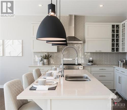 Large Kitchen island with bar style seating - 106 Westphalian Avenue, Ottawa, ON - Indoor Photo Showing Kitchen With Double Sink