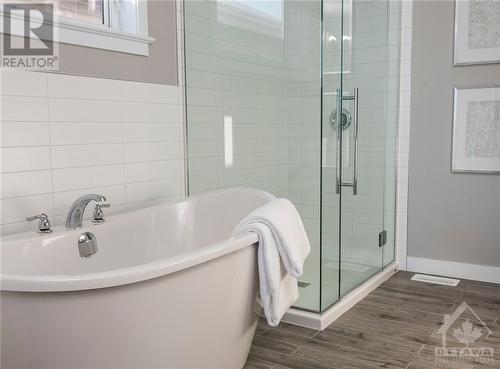 Primary Ensuite wth free standing soaker tub - 106 Westphalian Avenue, Ottawa, ON - Indoor Photo Showing Bathroom