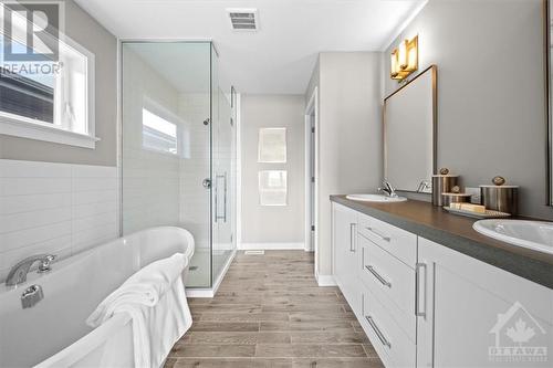 Primary ensuite with glass shower enclosure and double sinks. - 106 Westphalian Avenue, Ottawa, ON - Indoor Photo Showing Bathroom