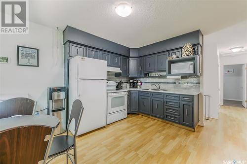 26 Marshall Crescent, Regina, SK - Indoor Photo Showing Kitchen With Double Sink