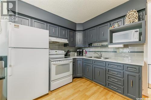 26 Marshall Crescent, Regina, SK - Indoor Photo Showing Kitchen With Double Sink