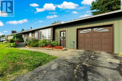 Exterior front showing close up of front walkway & attached 18 x 24 ft garage - 815 Joseph Street E, Cardinal, ON - Outdoor