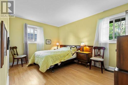 Primary bedroom with 2 windows for extra light - 815 Joseph Street E, Cardinal, ON - Indoor Photo Showing Bedroom