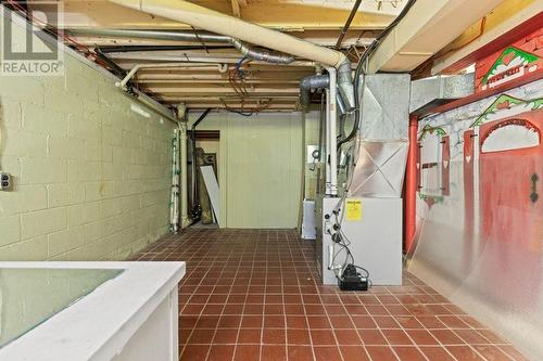 Utility room looking south showing newer furnace & fancy (!) tile floor. - 815 Joseph Street E, Cardinal, ON - Indoor Photo Showing Basement