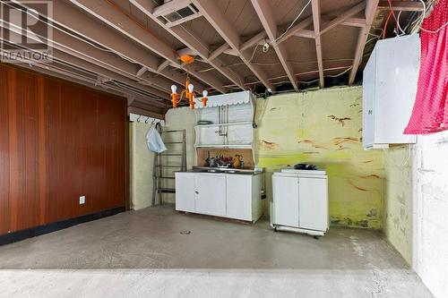 South west corner of Rec room opposite bar-The water still works in the utility sink-Extra laundry hookups in addition to the ones upstairs. - 815 Joseph Street E, Cardinal, ON - Indoor Photo Showing Laundry Room