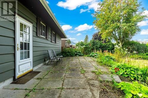 Rear patio looking north, surrounded by perennial gardens - 815 Joseph Street E, Cardinal, ON - Outdoor