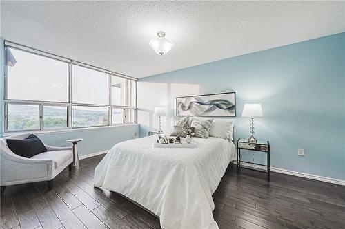 Primary Bedroom please note the paint colour is a much softer blue - 2055 Upper Middle Road|Unit #1408, Burlington, ON - Indoor Photo Showing Bedroom