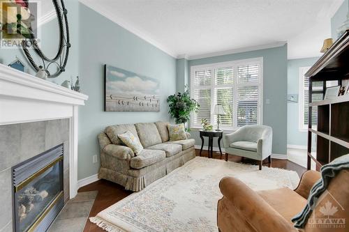 104 Purple Finch Crescent, Ottawa, ON - Indoor Photo Showing Living Room With Fireplace