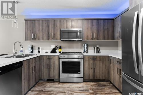 3542 Green Turtle Road, Regina, SK - Indoor Photo Showing Kitchen With Stainless Steel Kitchen With Double Sink With Upgraded Kitchen