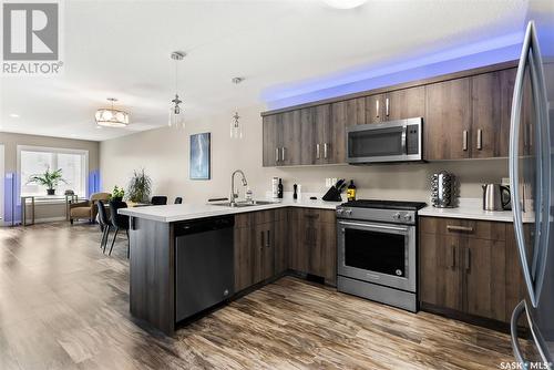 3542 Green Turtle Road, Regina, SK - Indoor Photo Showing Kitchen With Stainless Steel Kitchen With Double Sink With Upgraded Kitchen