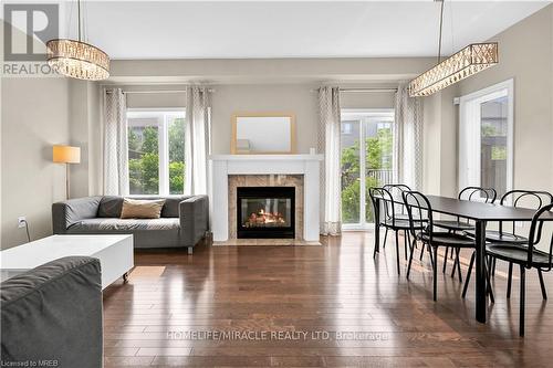 59 - 515 Winston Road, Grimsby, ON - Indoor Photo Showing Living Room With Fireplace