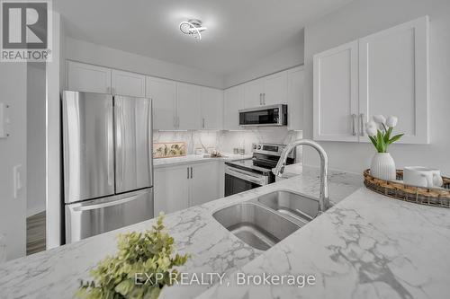 802 - 150 Dunlop Street E, Barrie (City Centre), ON - Indoor Photo Showing Kitchen With Stainless Steel Kitchen With Double Sink With Upgraded Kitchen