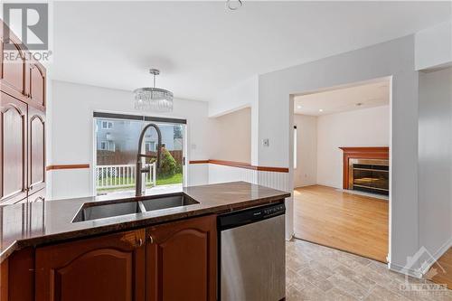 2112 Gardenway Drive, Ottawa, ON - Indoor Photo Showing Kitchen With Fireplace With Double Sink