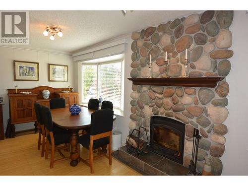 3622 16Th Avenue, Smithers, BC - Indoor Photo Showing Dining Room With Fireplace